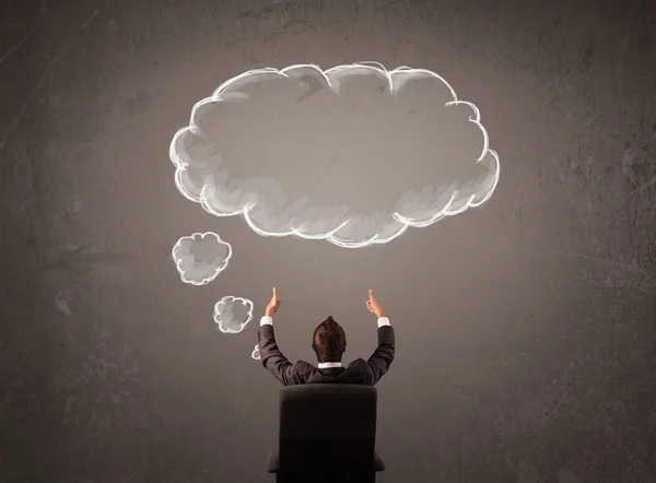 Businessman sitting with cloud thought above his head — Stock Photo, Image