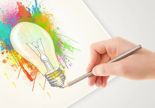 Hand drawing on paper a colorful splatter lightbulb — Stock Photo, Image