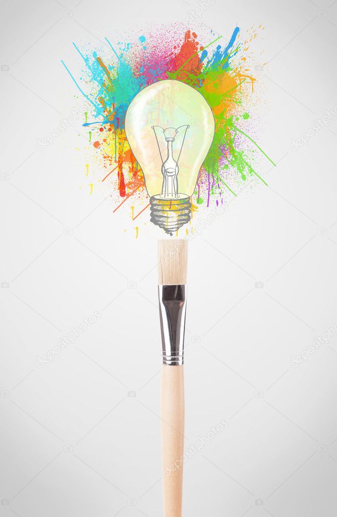 Brush close-up with colored paint splashes and lightbulb