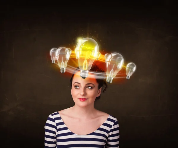 Woman with light bulbs circleing around her head — Stock Photo, Image