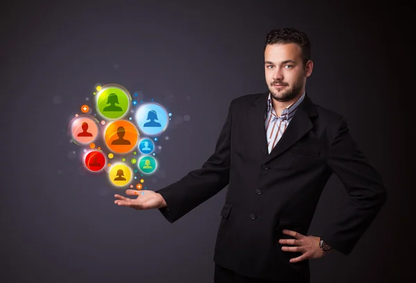 Social network icons in the hand of a businessman — Stock Photo, Image