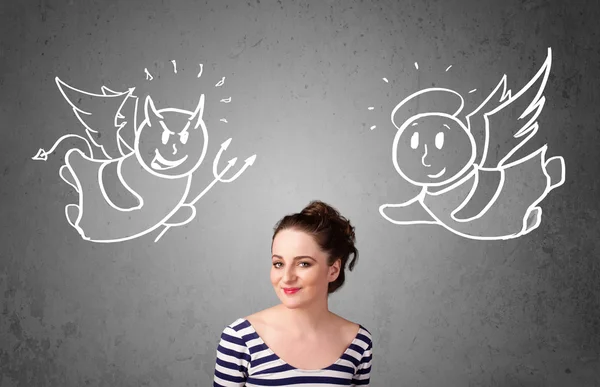 Woman standing between the angel and the devil — Stock Photo, Image