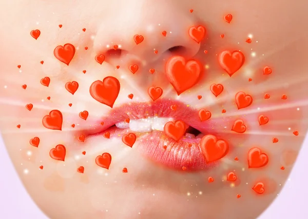 Pretty lady lips with lovely red hearts — Stock Photo, Image