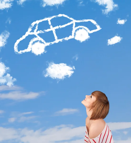 Young girl looking at car cloud on a blue sky — Stock Photo, Image