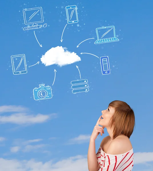 Casual girl looking at cloud computing concept on blue sky — Stock Photo, Image