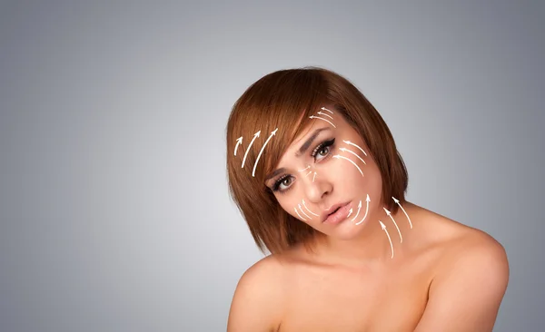 Beautiful girl with facial arrows on her skin — Stock Photo, Image