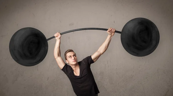 Muscular man lifting weights — Stock Photo, Image