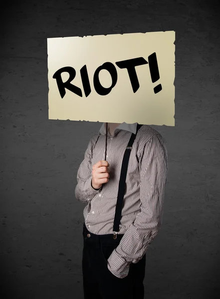 Businessman holding a protest sign — Stock Photo, Image