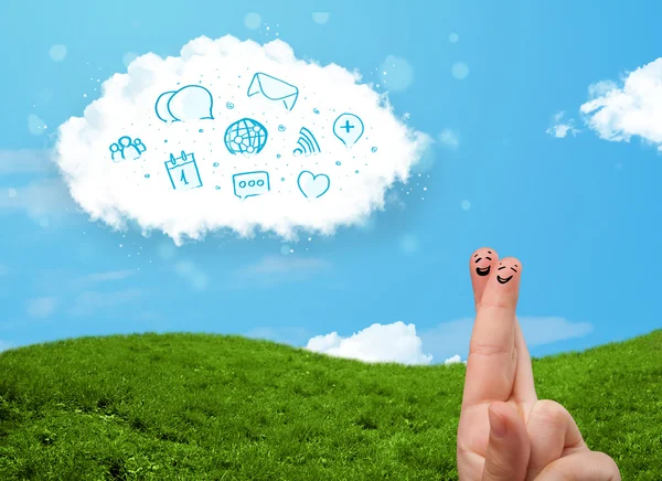 Happy smiley fingers looking at cloud with blue social icons and — Stock Photo, Image