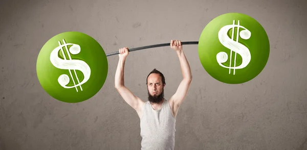 Skinny guy lifting green dollar sign weights — Stock Photo, Image