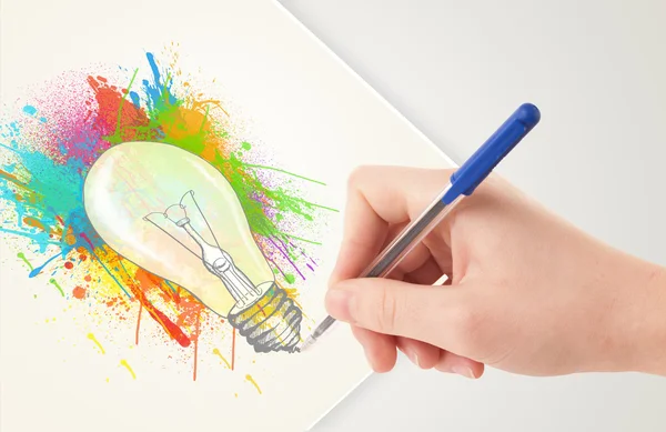 Hand drawing on paper a colorful splatter lightbulb — Stock Photo, Image