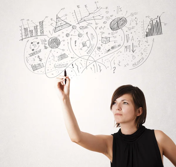 Chica bonita dibujando gráficos y diagramas en la pared —  Fotos de Stock