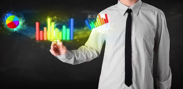 Handsome young business man touching colorful modern graph syste — Stock Photo, Image