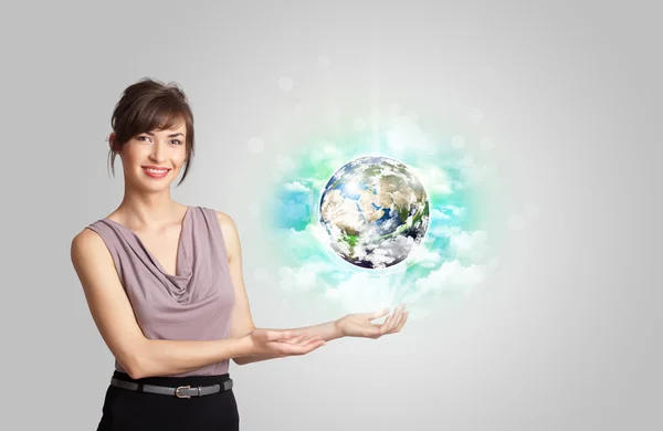 Young woman with earth and cloud concept — Stock Photo, Image