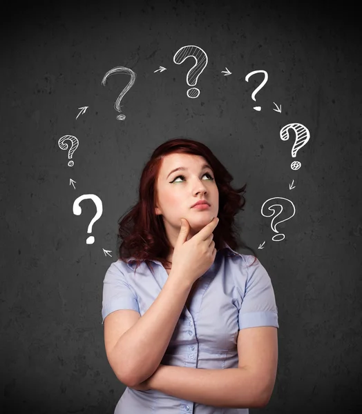 Young woman thinking with question mark circulation around her h — Stock Photo, Image