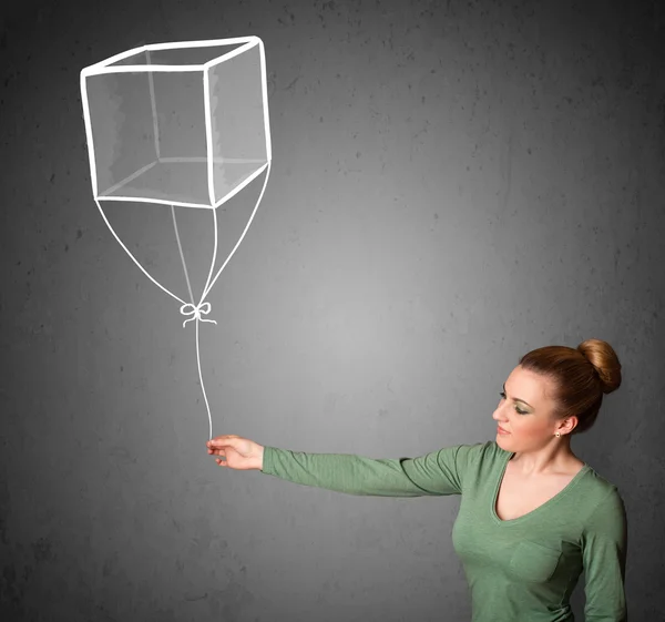 Woman holding a cube balloon — Stock Photo, Image