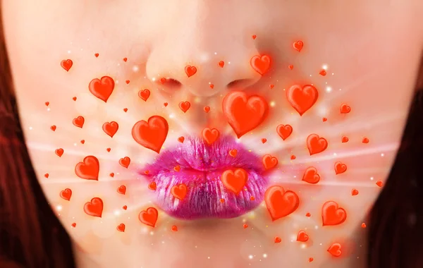 Pretty lady lips with lovely red hearts — Stock Photo, Image