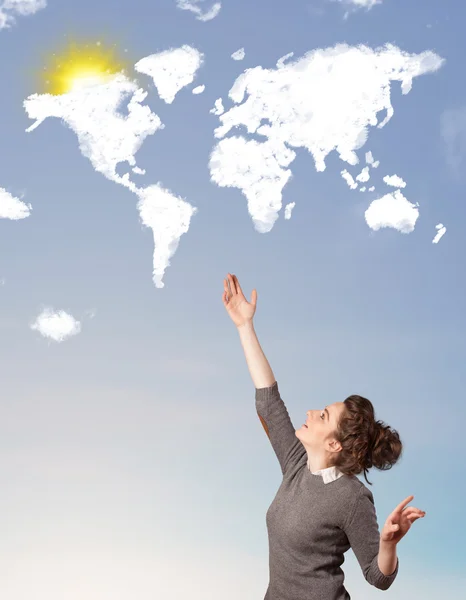 Young girl looking at world clouds and sun on blue sky — Stock Photo, Image