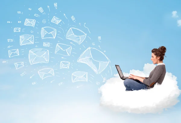 Young woman sitting in cloud with laptop — Stock Photo, Image