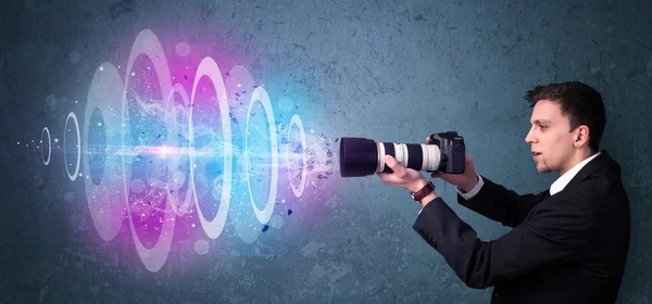 Photographer making photos with powerful light beam — Stock Photo, Image