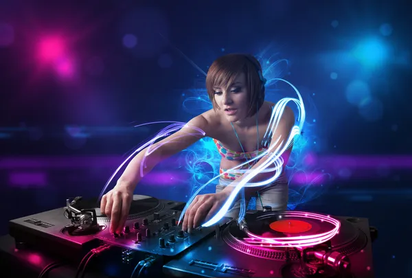 Disc jockey playing music with electro light effects and lights — Stock Photo, Image