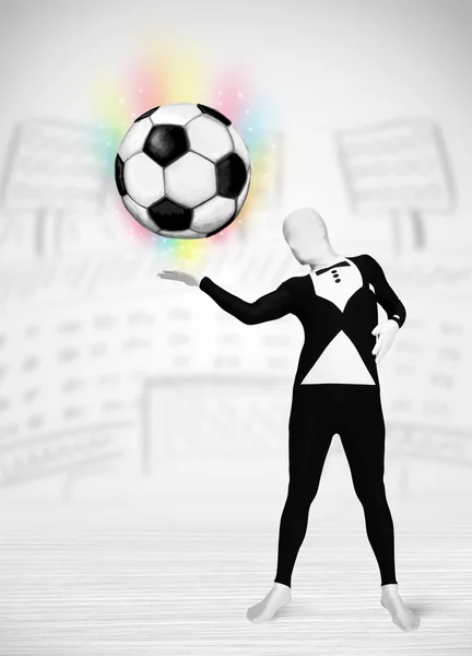 Man in full body suit holdig soccer ball — Stock Photo, Image