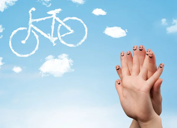 Happy smiley fingers looking at a bicycle shapeed cloud — Stock Photo, Image