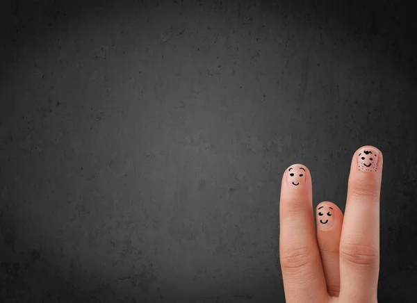 Happy finger smileys with empty copy space dark background — Stock Photo, Image