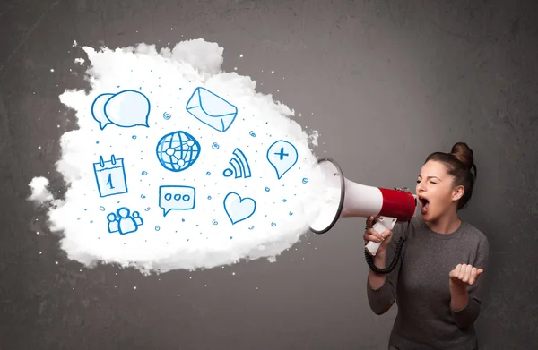 Woman shouting into loudspeaker and modern blue icons and symbol — Stock Photo, Image