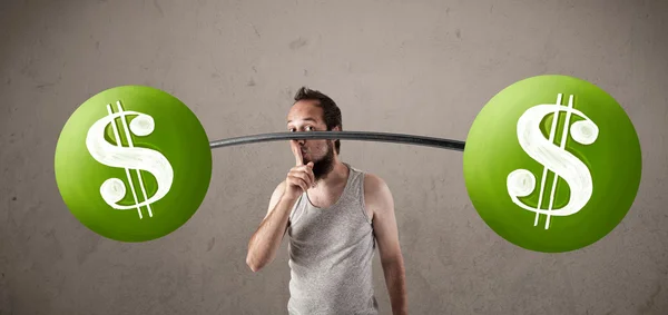 Skinny guy lifting green dollar sign weights — Stock Photo, Image