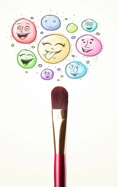 Smiley faces coming out of paintbrush — Stock Photo, Image