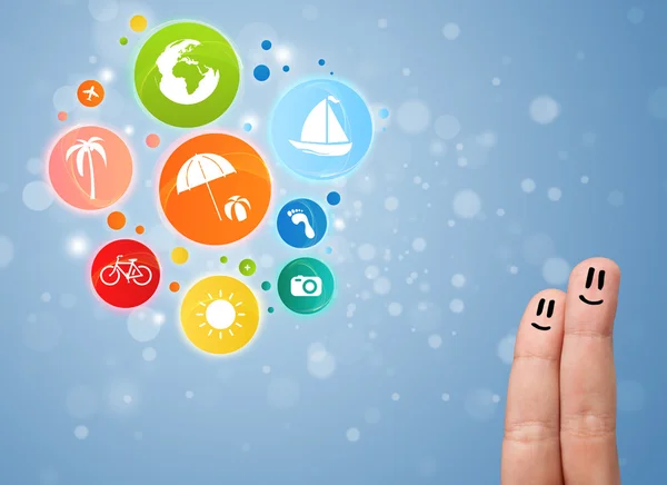 Cheerful finger smileys with colorful holiday travel bubble icon — Stock Photo, Image