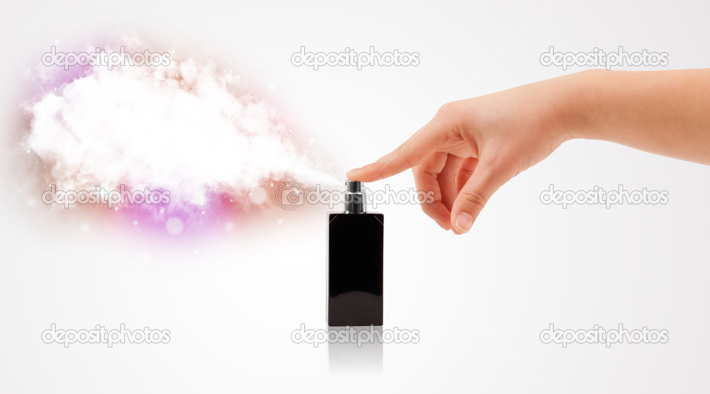 Woman hands spraying colorful cloud