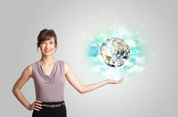 Young woman with earth and cloud concept — Stock Photo, Image