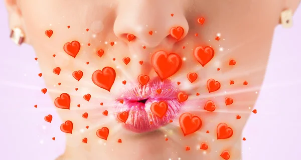 Pretty lady lips with lovely red hearts — Stock Photo, Image