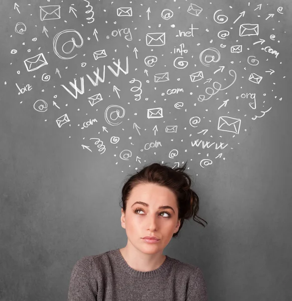 Young woman thinking with social network icons above her head — Stock Photo, Image