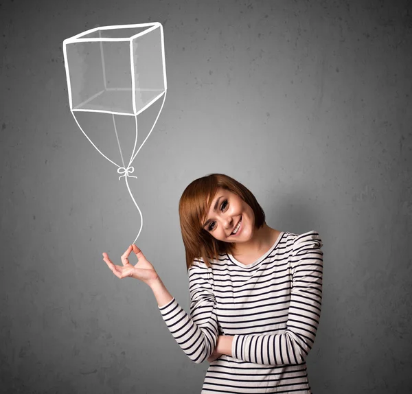 Mujer sosteniendo un globo cubo — Foto de Stock