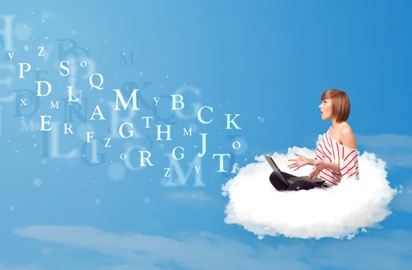 Young woman sitting in cloud with laptop — Stock Photo, Image