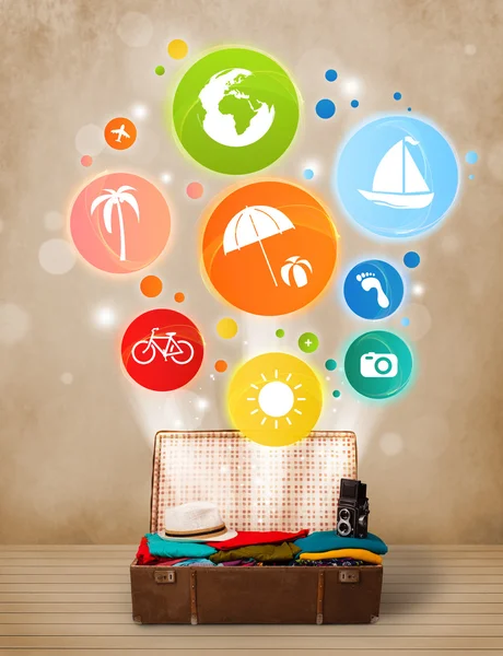 Suitcase with colorful summer icons and symbols — Stock Photo, Image