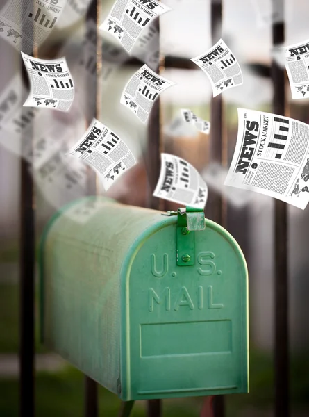 Post box with daily newspapers flying — Stock Photo, Image