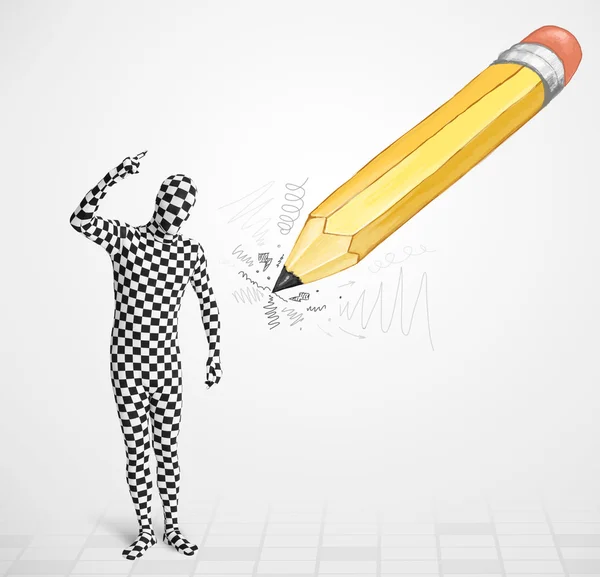 Guy in body mask with a big hand drawn pencil — Stock Photo, Image