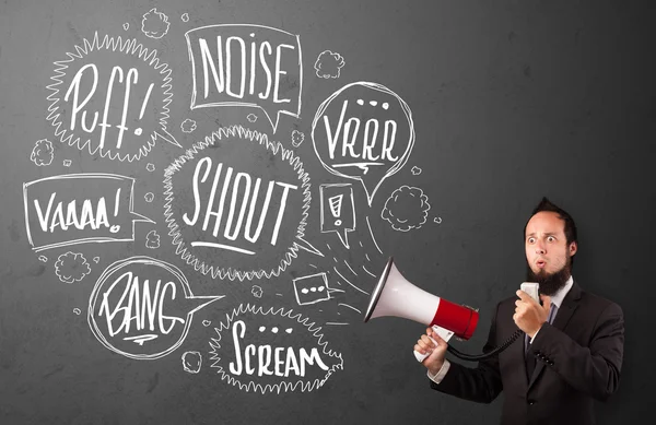 Guy in suit yelling into megaphone and hand drawn speech bubbles — Stock Photo, Image