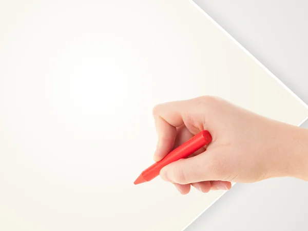 Child drawing with colorful crayon on empty blank paper — Stock Photo, Image