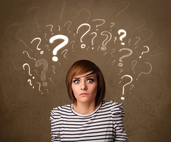 Girl with question mark symbols around her head — Stock Photo, Image