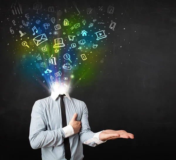 Business man with glowing media icons exploding head — Stock Photo, Image