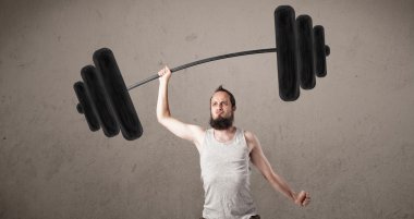 Ağırlık kaldıran komik sıska adam.