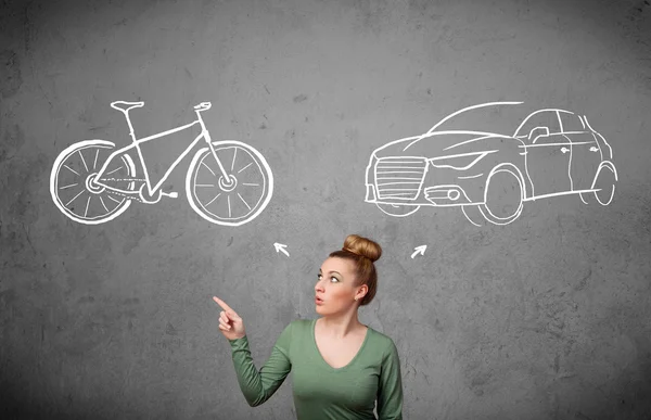 Woman making a choice between bicycle and car — Stock Photo, Image