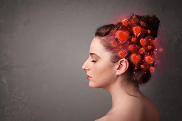 Joven pensando en el amor con corazones rojos — Foto de Stock