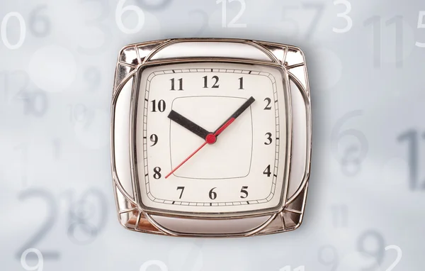 Modern clock with numbers comming out — Stock Photo, Image