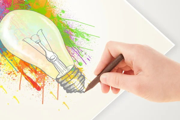 Hand drawing on paper a colorful splatter lightbulb — Stock Photo, Image